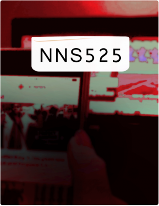 NNS 525 is written in black text, with a phone screen and computer screen in the background.