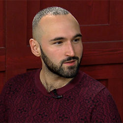 Francisco-Fernando Granados doing an interview, with a red wall in the background.